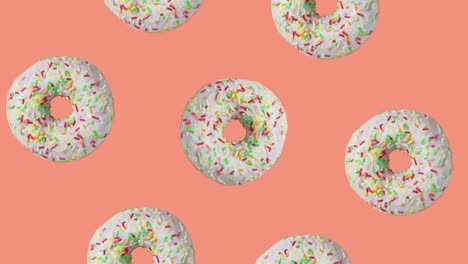 glazed donuts rotating around donut on orange background, 3d video animation.