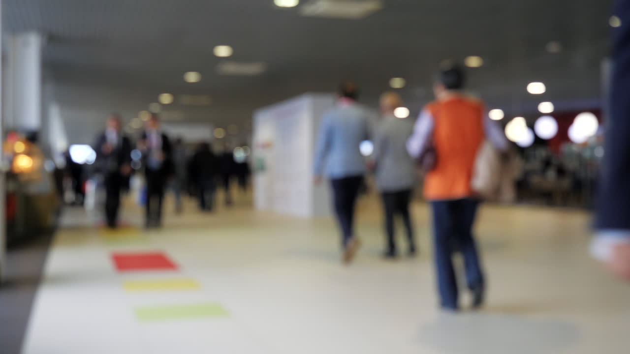 Blurred view of people in a hall