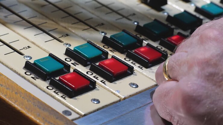 ON and OFF keys being pushed for an Autogram Pacemaker Audio console for a FM radio station