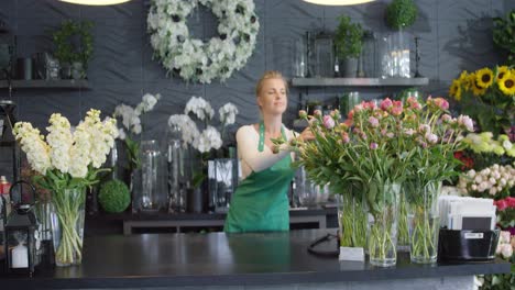 woman arranging bouquets