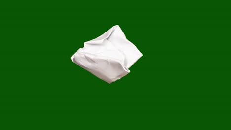 zerrissenes papier auf grünem hintergrund