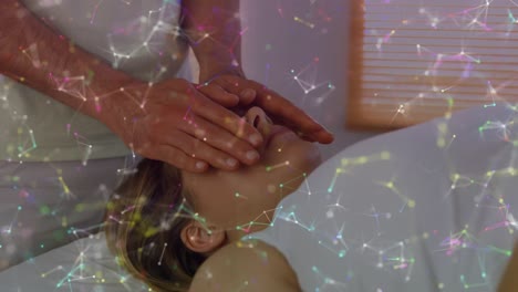 Animation-of-constellations-moving-over-hands-of-caucasian-man-doing-massage-to-female-customer