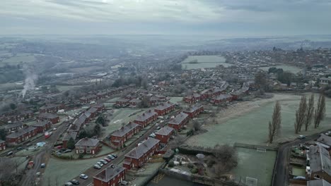 4k cinematic aerial footage, depicting a harsh winter cold spell with mist and freezing temperatures