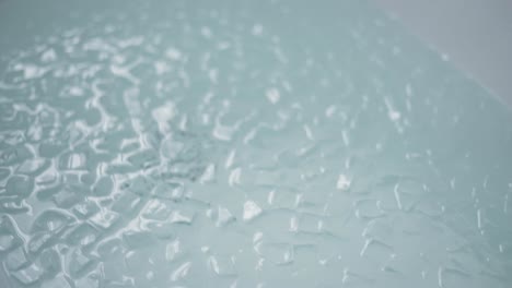 A-bath-full-with-ice-cubes,-close-up