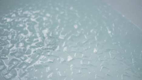 a bath full with ice cubes, close up