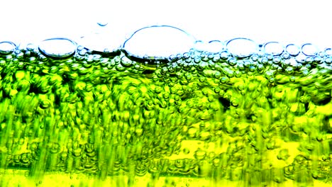 water oil bubbles  behind glass background