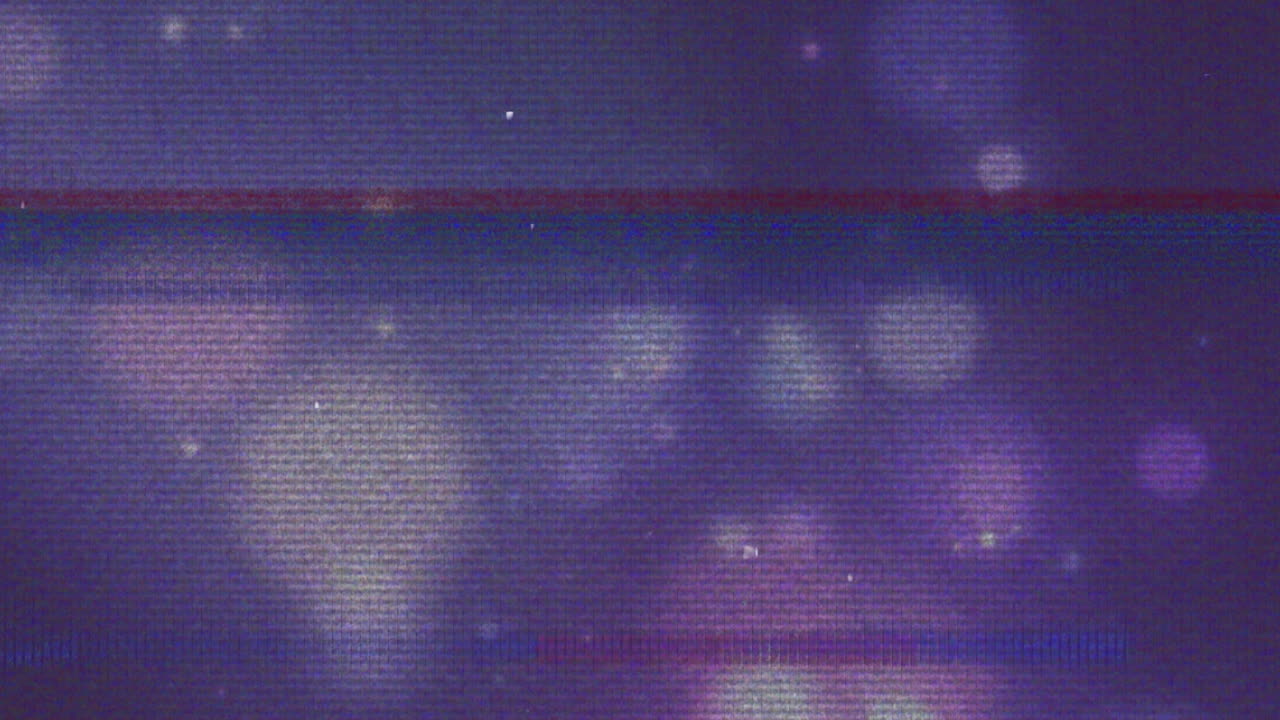 Animation af glitch-forstyrrelse over glødende punkter på lilla baggrund