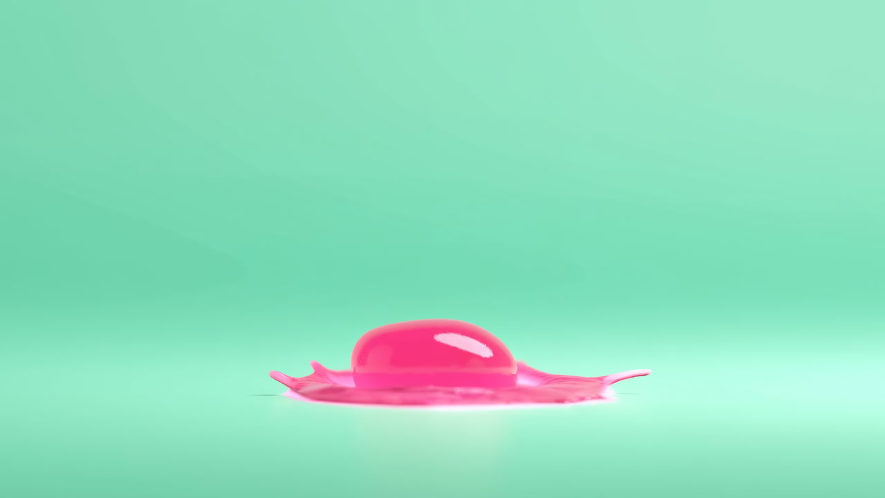 Pink Glossy Sphere Drops Into Mint Green Studio Surface, Slow Motion Liquid Impact Forms Crown And Ripples,