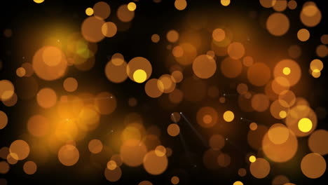 animation of golden spots of light falling on brown background