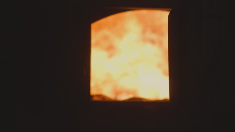 flame burning in industrial furnace at metalworking plant