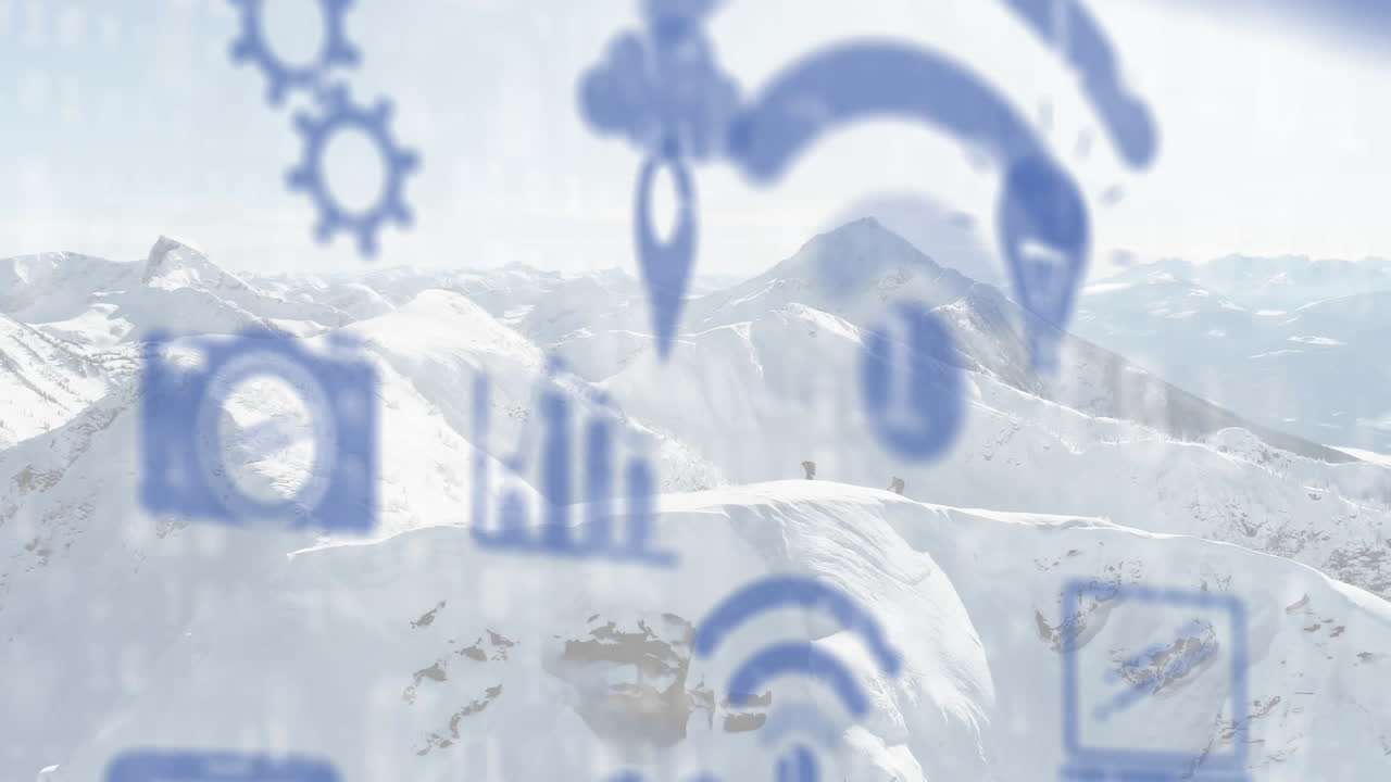 겨울 산 풍경 위에 떠다니는 디지털 아이콘의 애니메이션