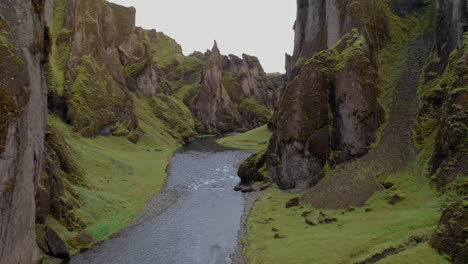 aerial: fjadrargljufur canyon in iceland during a cloudy day