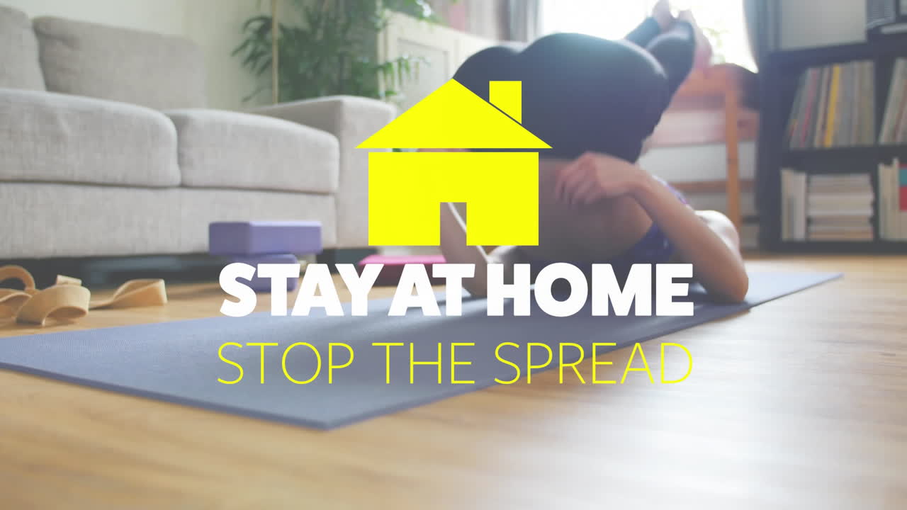 Animation of yellow house with social distancing message over Asian woman stretching