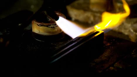 Welding-torch-is-being-used-to-melt-jewellery-in-workshop-4k
