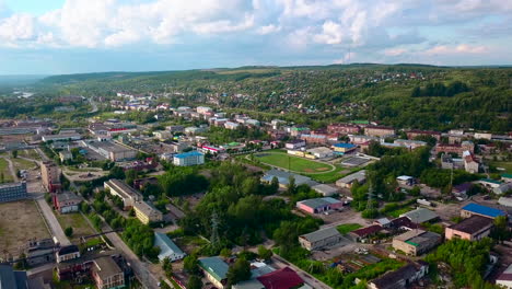 aerial view of a town with river and hills