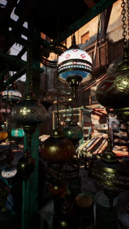 close-up of colourful arabic lamps hanging from a stall in a souk