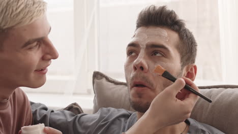 two young men having beauty procedures at home