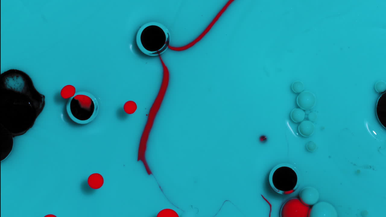 Blue, Red, and Black Abstract background fluid art, mixing acrylic paint and oil with popping bubbles and swirls