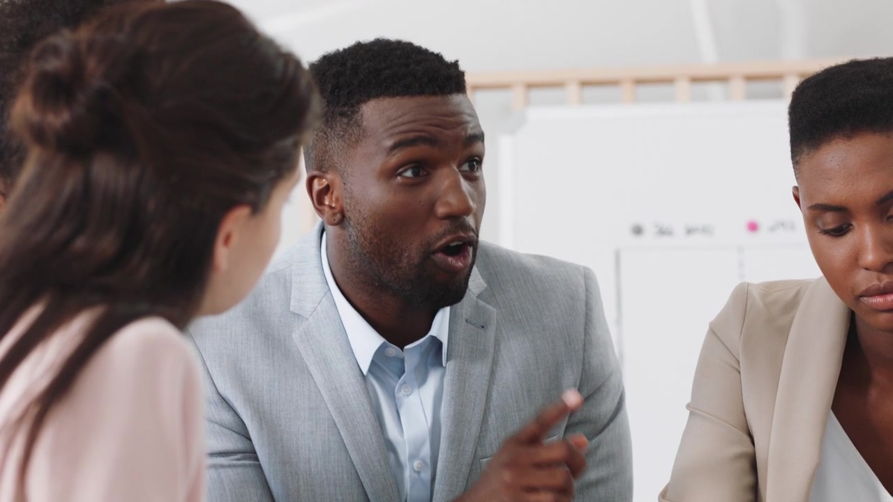 Diverse Business Team Collaborating in a Professional Office Meeting