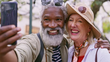 a happy older couple taking a selfie on vacation