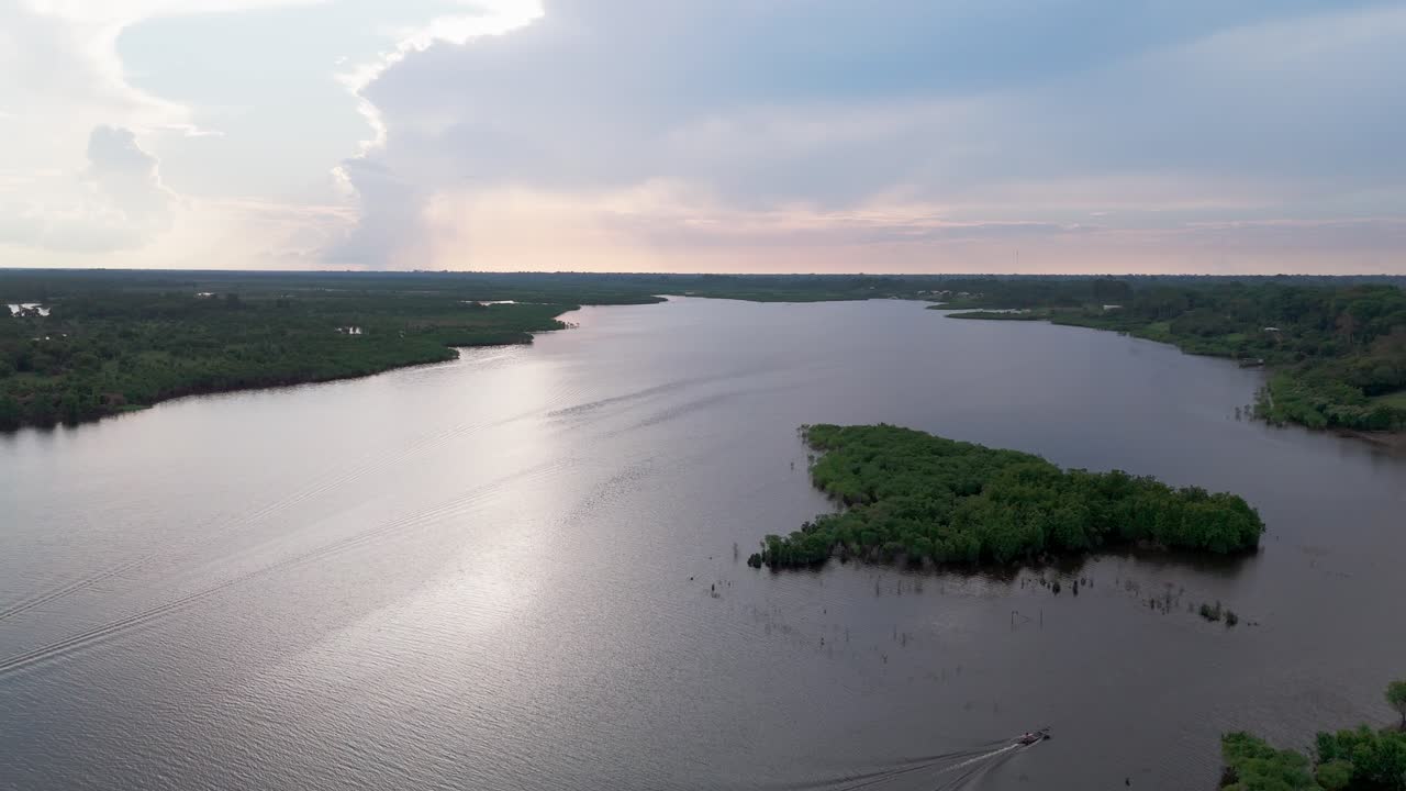 Aerial, Tropical Transportation, Silhouetted Motorboat, Amazon Travels