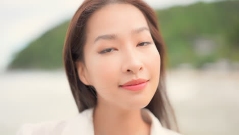 close up portrait of happy confident young asian woman in exterior