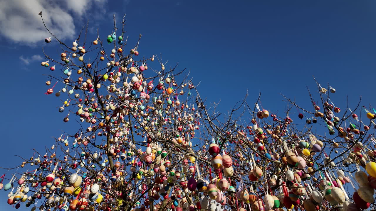 Easter egg tree against a clear blue sky