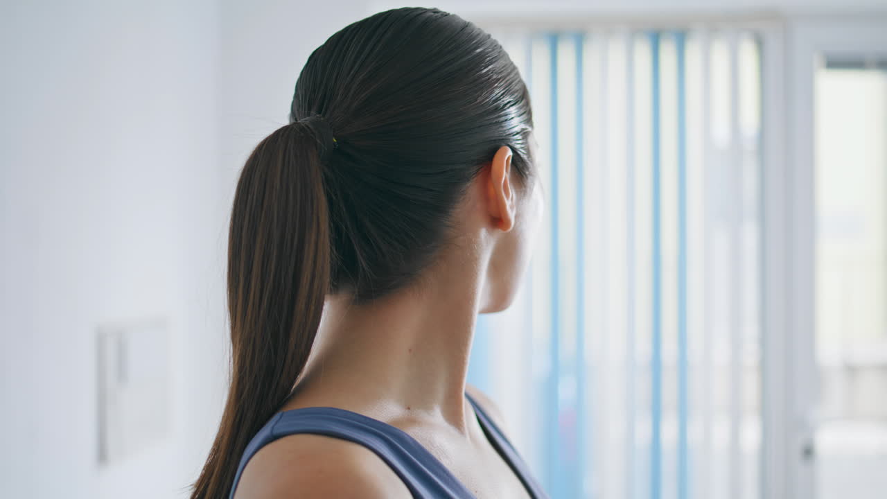 Closeup athlete woman head exercises home. Yoga lady warming body training neck