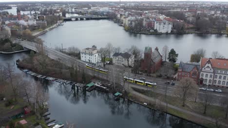 the cinematic drone video was made in berlin köpenick and shows two trams passing each other.
in the background you can see an interestingl bridge and a river.