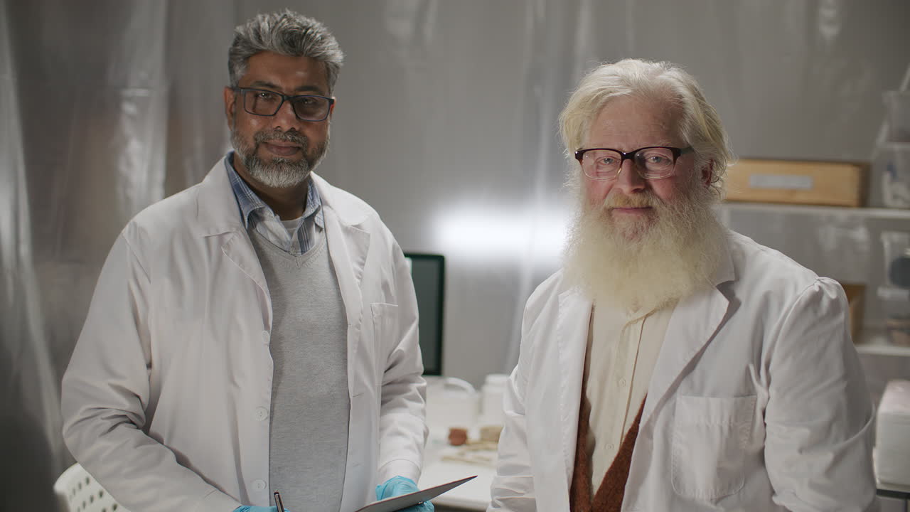 Portrait of Two Senior Archaeologists at Work in Research Laboratory