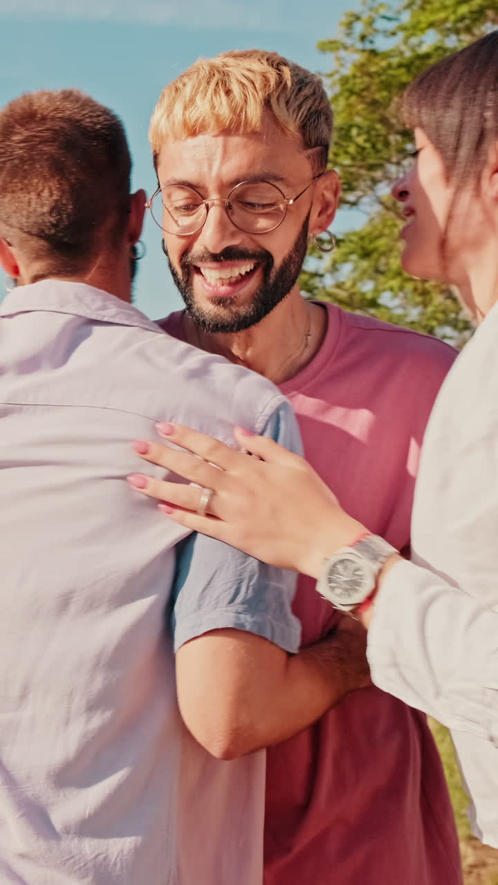 Friends Hugging and Enjoying a Sunny Picnic