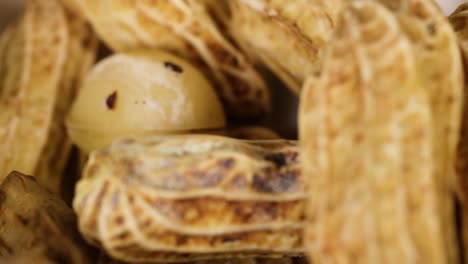 detailed view of peanuts and assorted nuts showcasing textures and natural colors in a close-up arrangement.