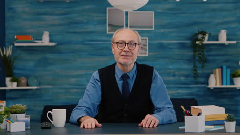 POV-of-elderly-aged-man-waving-during-a-video-conference