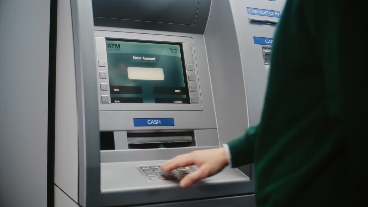 Unrecognizable Person Entering PIN Code on ATM Keypad to Withdraw Money. Error Message on Cash Machine Display About Transaction Cancellation Due to Incorrect PIN Code. Banking Equipment. Close Up.
