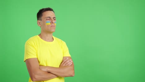 Ukrainian patriot man looking away with serious expression