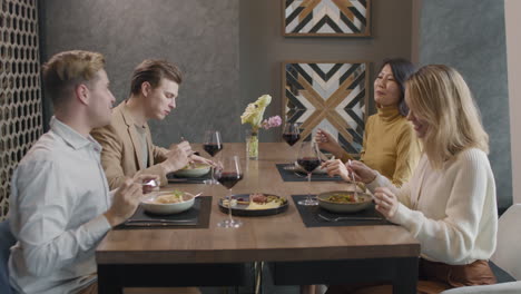 friends enjoying a meal at a modern restaurant