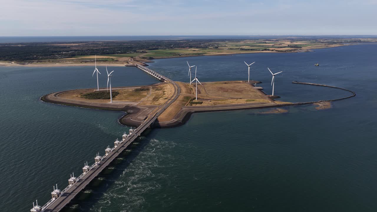 wind turbines at the Oosterscheldekering Eastern Scheldt Storm Surge Barrier. The Netherlands. Clean energy, wind power, and renewable infrastructure. Aerial video