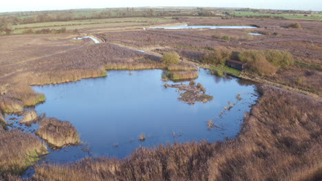 Wide-general-aerial-view-of-Stodmarsh-nature-reserve,-Kent,-UK-managed-by-natural-England