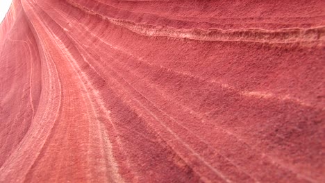 closeup of the swirling pattern in an orange sandstone rock formation