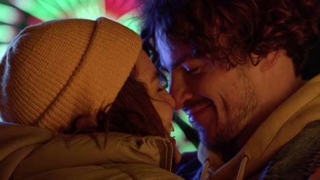 Love-couple-rubbing-noses-on-urban-street.-Happy-pair-smiling-in-city-center.