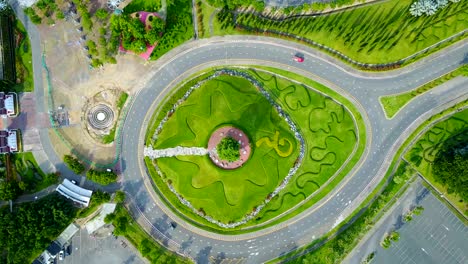 aerial view of a traffic circle, roundabout with green garden at rajapruek park, chiangmai, thailand.