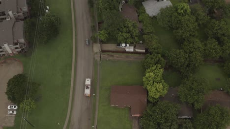 A-firetruck-slowly-travels-through-a-flash-flooded-neighborhood