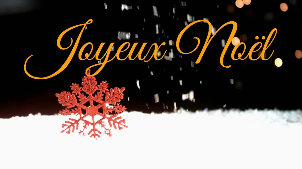 Joyeux No&Atilde;&laquo;l written over snow falling
