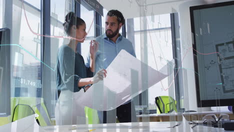 Discussing financial plans, business professionals with data animation overlay in office