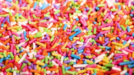 vibrant sprinkles moving in a dynamic pattern