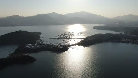 sunset over hong kong bay unique landscape with small boat marina, aerial view