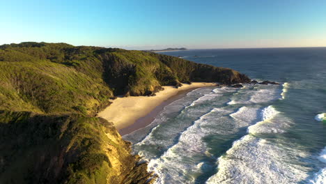 Revealing-drone-shot-of-Broken-Head-shoreline-near-Byron-Bay