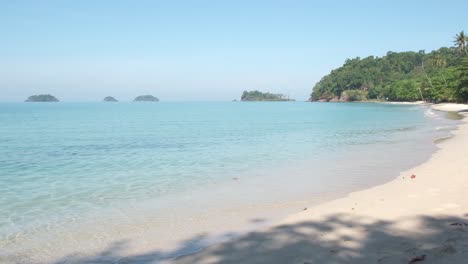 white sand beach on koh chang thailand with islands in background