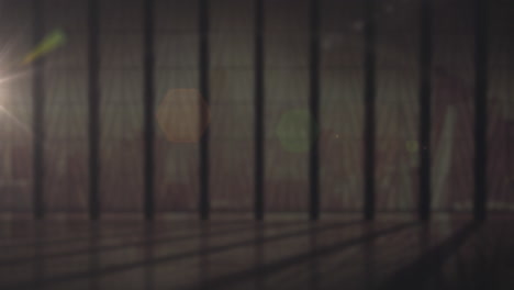 animation of window with bars with glowing spots of light  in the background