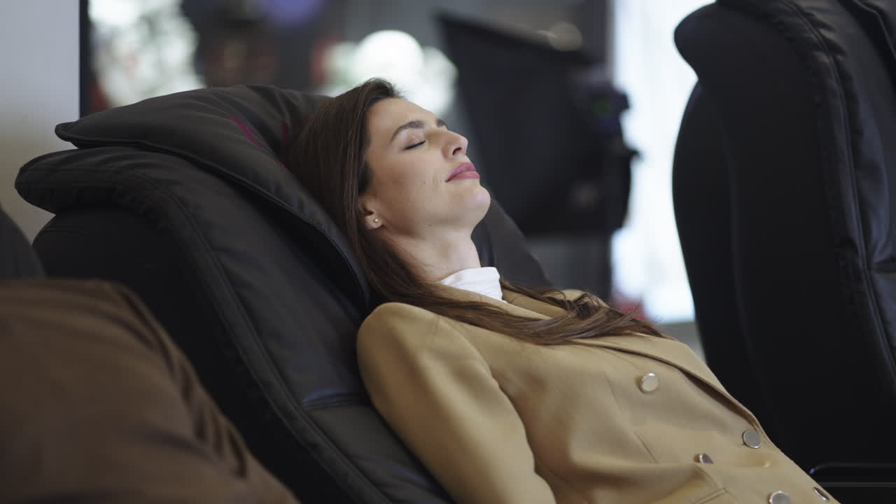 Woman relaxing in a massage chair